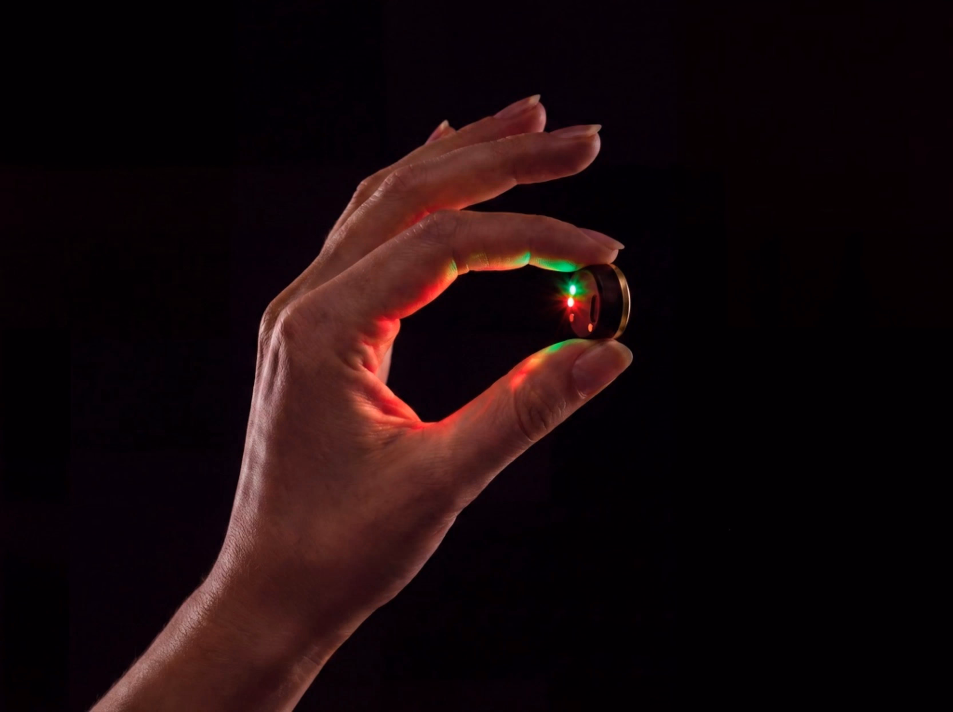 The tiny Bean sensor held between two fingers